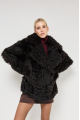 Double-sided curly sheepskin coat in dark chocolate color made of natural sheepskin in OVERSIZE style